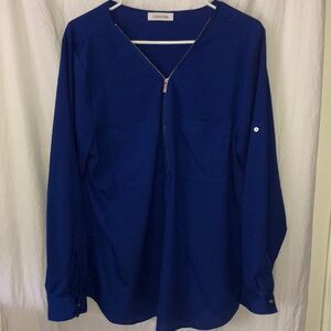 Electric Blue Calvin Klein Silver Front Zip made famous by Alison Janey in “Mom”